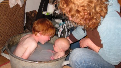 Big brother Talus bathes with Annika